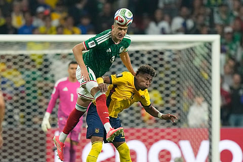 Mexico's Cesar Montes (3) battles for the ball with Ecuador's Kevin Rodriguez (11) during the World Cup round of 32 soccer match between Mexico and Ecuador in Mexico City, Tuesday, June 30, 2026.