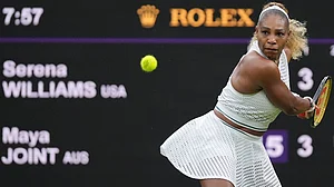 AP Photo/Maja Smiejkowska : Serena Williams of the United States plays a backhand against Maya Joint of Australia in their first round women's singles match at the Wimbledon Tennis Championships in London, Tuesday, June 30, 2026.
