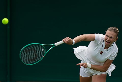 Amanda Anisimova of the United States plays a return to Lina Gjorcheska of North Macedonia during their women's singles match at the Wimbledon Tennis Championships in London, Tuesday, June 30, 2026.