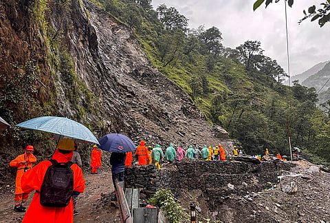 SDRF personnel and officials clear debris after a landslide blocked the Kedarnath pilgrimage route between Sonprayag and Munkatiya following heavy rain, in Rudraprayag district.