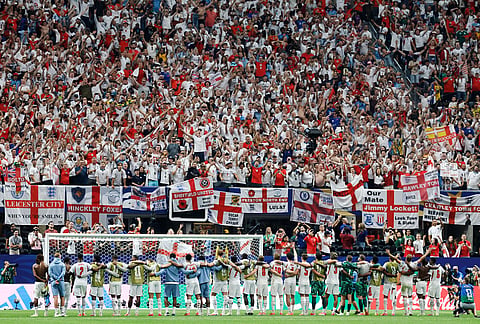 England's players celebrate with fans at the end of the World Cup round of 32 soccer match between England and Congo in Atlanta, Wednesday, July 1, 2026.  