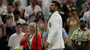 (AP Photo/Brian Inganga) : Novak Djokovic of Serbia speaks to the public after his victory against Stefanos Tsitsipas of Greece in their second round men's singles match at the Wimbledon Tennis Championships in London, Wednesday, July 1, 2026