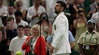 (AP Photo/Brian Inganga) : Novak Djokovic of Serbia speaks to the public after his victory against Stefanos Tsitsipas of Greece in their second round men's singles match at the Wimbledon Tennis Championships in London, Wednesday, July 1, 2026