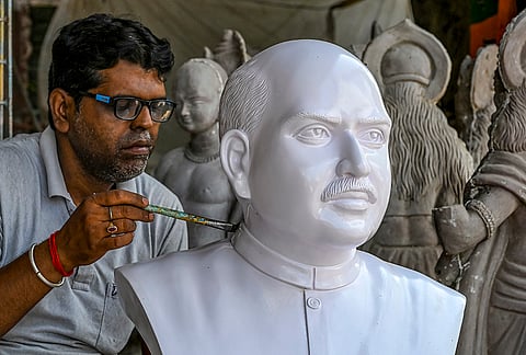 An artisan gives finishing touches to a bust of Bharatiya Jana Sangh founder Dr. Shyama Prasad Mukherjee ahead of his birth anniversary celebrations, at a workshop in Nadia district, West Bengal.