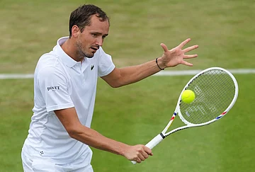 | Photo: AP/Kirsty Wigglesworth : Daniil Medvedev of Russia returns the ball during the second round men's singles match against Daniel Merida of Spain at the Wimbledon Tennis Championships in London, Wednesday, July 1, 2026.