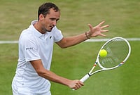 | Photo: AP/Kirsty Wigglesworth : Daniil Medvedev of Russia returns the ball during the second round men's singles match against Daniel Merida of Spain at the Wimbledon Tennis Championships in London, Wednesday, July 1, 2026.