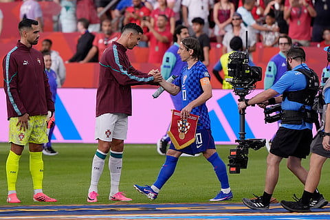 Portugal's Cristiano Ronaldo (7) shakes hands with Croatia's Luka Modric (10) before the World Cup round of 32 soccer match between Portugal and Croatia in Toronto, Thursday, July 2, 2026.