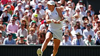 AP Photo/Kirsty Wigglesworth : Iga Swiatek of Poland returns the ball during the second round women's singles match against Karolina Pliskova of the Czech Republic at the Wimbledon Tennis Championships in London, Thursday, July 2, 2026.(