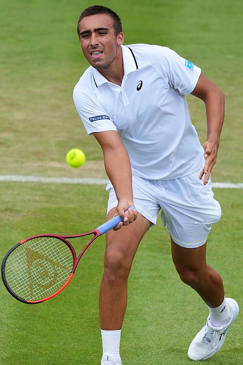 Daniel Merida of Spain returns the ball during the second round men's singles match against Daniil Medvedev of Russia at the Wimbledon Tennis Championships in London, Wednesday, July 1, 2026.
