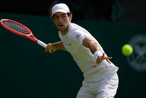 Nuno Borges of Portugal plays a forehand against Jannik Sinner of Italy in their second round men's singles match at the Wimbledon Tennis Championships in London, Wednesday, July 1, 2026.