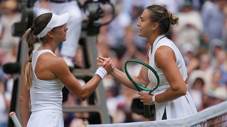 Aryna Sabalenka of Belarus, right, and McCartney Kessler of the United States shake hands after their second round women's singles match, at Wimbledon Tennis Championships in London, Wednesday, July 1, 2026 - (AP Photo/Kin Cheung)