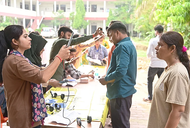 An aspirant undergoes security check as she arrives to appear for the Uttar Pradesh Teacher Eligibility Test (UPTET) conducted by the Uttar Pradesh Education Service Selection Commission (UPESSC), in Prayagraj. - | Photo: PTI
