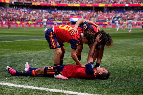 Spain's Mikel Oyarzabal (21) celebrates scoring his side's third goal against Austria with teammates Gavi (9) and Marc Cucurella during the World Cup round of 32 soccer match in Inglewood, Calif., near Los Angeles, Thursday, July 2, 2026.