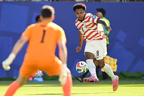United States' Weston McKennie (8) crosses the ball as Bosnia goalkeeper Nikola Vasilj (1) watches during the World Cup round of 32 soccer match between the United States and Bosnia in Santa Clara, Calif., near San Francisco, Wednesday, July 1, 2026