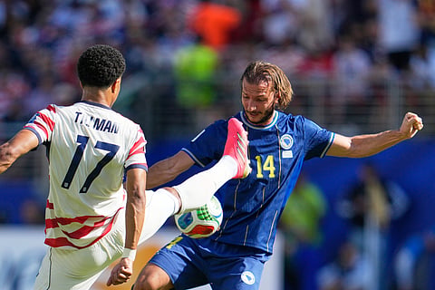 United States' Malik Tillman, front, and Bosnia's Ivan Sunjic battle for the ball during the World Cup round of 32 soccer match in Santa Clara, Calif., near San Francisco, Wednesday, July 1, 2026