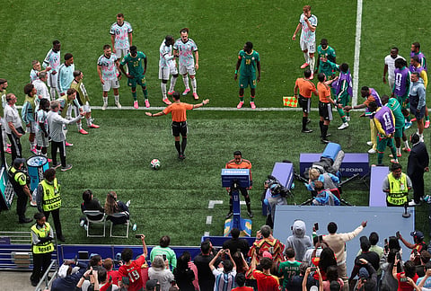 Referee Said Martinez, of Honduras checks the VAR during the World Cup round of 32 soccer match between Belgium and Senegal in Seattle, Wednesday, July 1, 2026. 