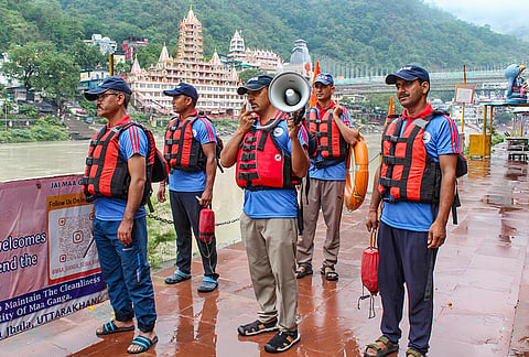 Personnel of the Uttarakhand SDRF and Fire Services participate in a river safety mock drill organised by the National Disaster Management Authority (NDMA) ahead of the monsoon, in Rishikesh.