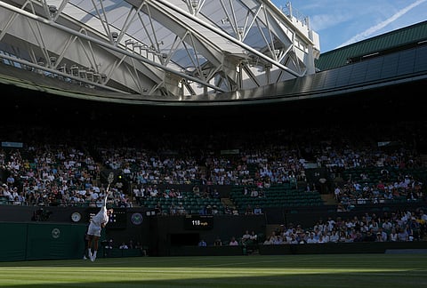 Felix Auger-Aliassime of Canada serves against Dino Prizmic of Croatia in their second round men's singles match at the Wimbledon Tennis Championships in London, Wednesday, July 1, 2026.