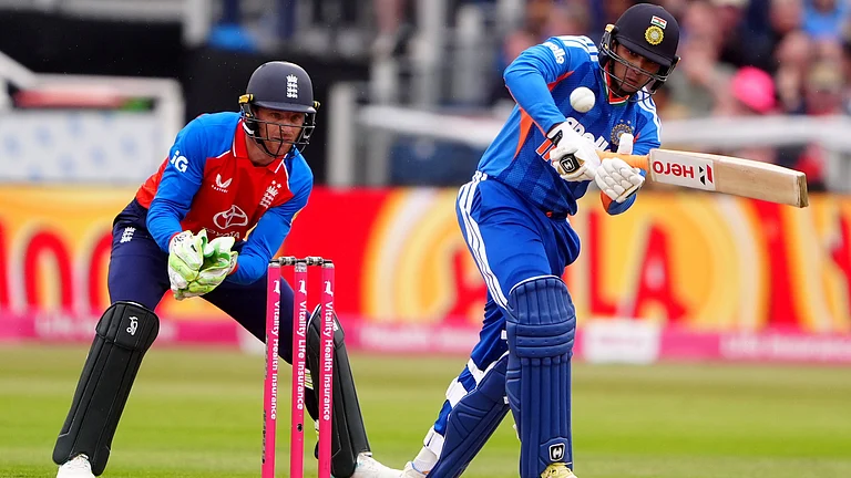 India's Abhishek Sharma bats with England wicketkeeper Jos Buttler during the first IT20 cricket match at Chester-le-Street, England, Wednesday July 1, 2026 - (Owen Humphreys/PA via AP)