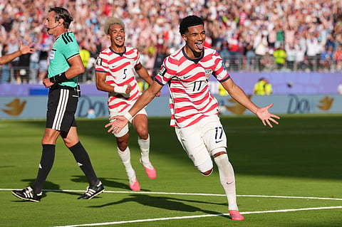 United States' Malik Tillman (17) celebrates after scoring on a free kick as United States' Antonee Robinson (5) runs behind during the World Cup round of 32 soccer match between the United States and Bosnia in Santa Clara, Calif., near San Francisco, Wednesday, July 1, 2026