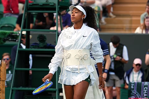 Naomi Osaka of Japan enters the court for the second round women's singles match against Anastasia Gasanova of Russia at the Wimbledon Tennis Championships in London, Wednesday, July 1, 2026.