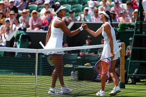 Naomi Osaka of Japan and Anastasia Gasanova of Russia shake hands after their second round women's singles match at the Wimbledon Tennis Championships in London, Wednesday, July 1, 2026.