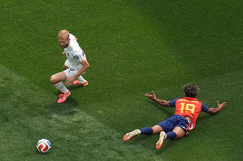 Spain's Lamine Yamal, right, falls on the pitch past Austria's Konrad Laimer during the World Cup round of 32 soccer match between Spain and Austria in Inglewood, Calif., near Los Angeles, Thursday, July 2, 2026.