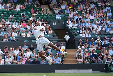 Felix Auger-Aliassime of Canada returns the ball to Dino Prizmic of Croatia in their second round men's singles match at the Wimbledon Tennis Championships in London, Wednesday, July 1, 2026.