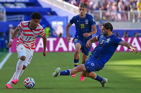 United States' Malik Tillman (17) and Bosnia's Sead Kolasinac (5) battle for the ball during the World Cup round of 32 soccer match between the United States and Bosnia in Santa Clara, Calif., near San Francisco, Wednesday, July 1, 2026
