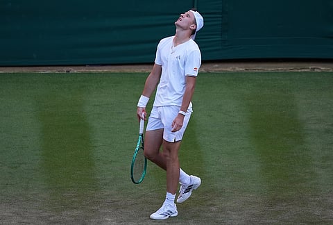 Jakub Mensik of Czech Republic looks dejected after losing a point against Grigor Dimitrov of Bulgaria in their second round men's singles match at the Wimbledon Tennis Championships in London, Thursday, July 2, 2026. 