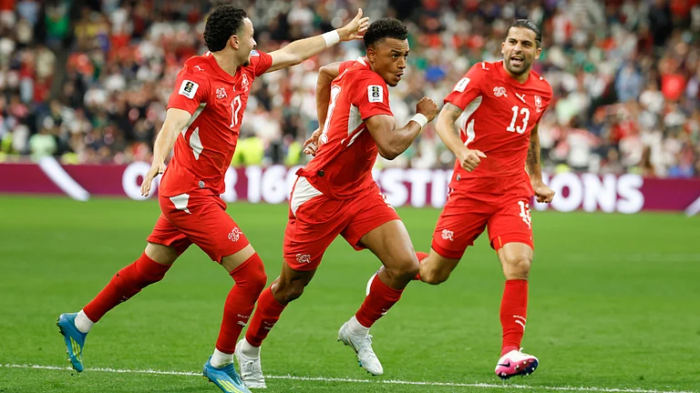 Switzerland's Dan Ndoye, center, celebrates with Ruben Vargas, left, and Ricardo Rodriguez after scoring his side's second goal during the World Cup round of 32 soccer match between Switzerland and Algeria in Vancouver, British Columbia, Thursday, July 2, 2026 - (Peter Klaunzer/Keystone via AP)