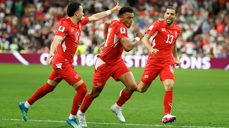 (Peter Klaunzer/Keystone via AP) : Switzerlands Dan Ndoye, center, celebrates with Ruben Vargas, left, and Ricardo Rodriguez after scoring his sides second goal during the World Cup round of 32 soccer match between Switzerland and Algeria in Vancouver, British Columbia, Thursday, July 2, 2026