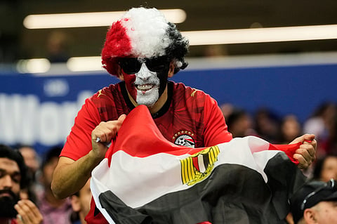 A fan of Egypt poses for a photo prior to the World Cup round of 32 soccer match between Australia and Egypt in Arlington