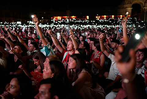Fans watching on a big screen in Lisbon, Portugal, turn on their phone lights at the 21st minute to celebrate the late Portugal player Diogo Jota during the World Cup round of 32 soccer match between Portugal and Croatia, Friday, July 3, 2026.