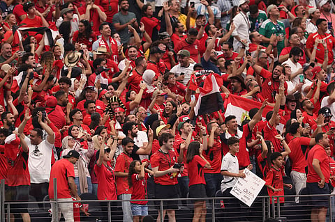 Egypt fans celebrate after their team score the opening goal during the World Cup round of 32 soccer match between Australia and Egypt in Arlingto