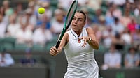Aryna Sabalenka Vs Jelena Ostapenko Live Score, Wimbledon 2026: Top Seed's Heavy Hitting Puts Ostapenko Under Pressure | Photo: AP/Kin Cheung : Aryna Sabalenka of Belarus returns the ball to McCartney Kessler of the United States in their second round women's singles match at the Wimbledon Tennis Championships in London, Wednesday, July 1, 2026.