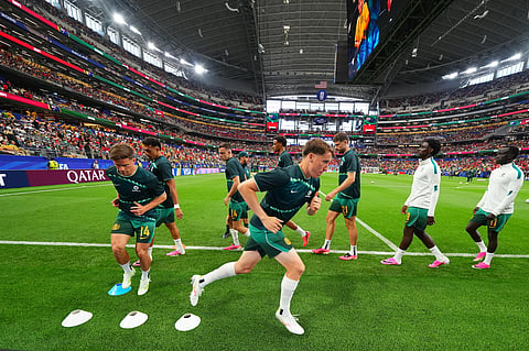 Australia players warm up prior to their World Cup round of 32 soccer match against Egypt in Arlington