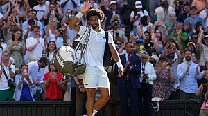 (AP Photo/Kirsty Wigglesworth) : Arthur Fils of France waves to the crowd after losing the second round men's singles match against Matteo Berrettini of Italy at the Wimbledon Tennis Championships in London, Thursday, July 2, 2026