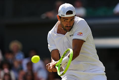 Matteo Berrettini of Italy returns the ball during the second round men's singles match against Arthur Fils of France at the Wimbledon Tennis Championships in London, Thursday, July 2, 2026.
