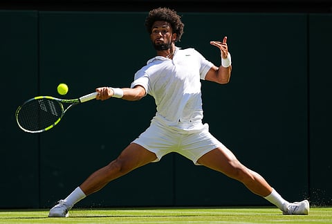 Arthur Fils of France returns the ball during the second round men's singles match against Matteo Berrettini of Italy at the Wimbledon Tennis Championships in London, Thursday, July 2, 2026.