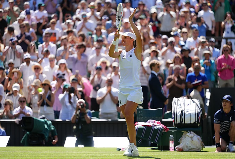 Iga Swiatek of Poland celebrates winning the second round women's singles match against Karolina Pliskova of the Czech Republic at the Wimbledon Tennis Championships in London, Thursday, July 2, 2026. - | Photo: AP/Kirsty Wigglesworth