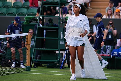 Naomi Osaka of Japan enters the court for the second round women's singles match against Anastasia Gasanova of Russia at the Wimbledon Tennis Championships in London, Wednesday, July 1, 2026.