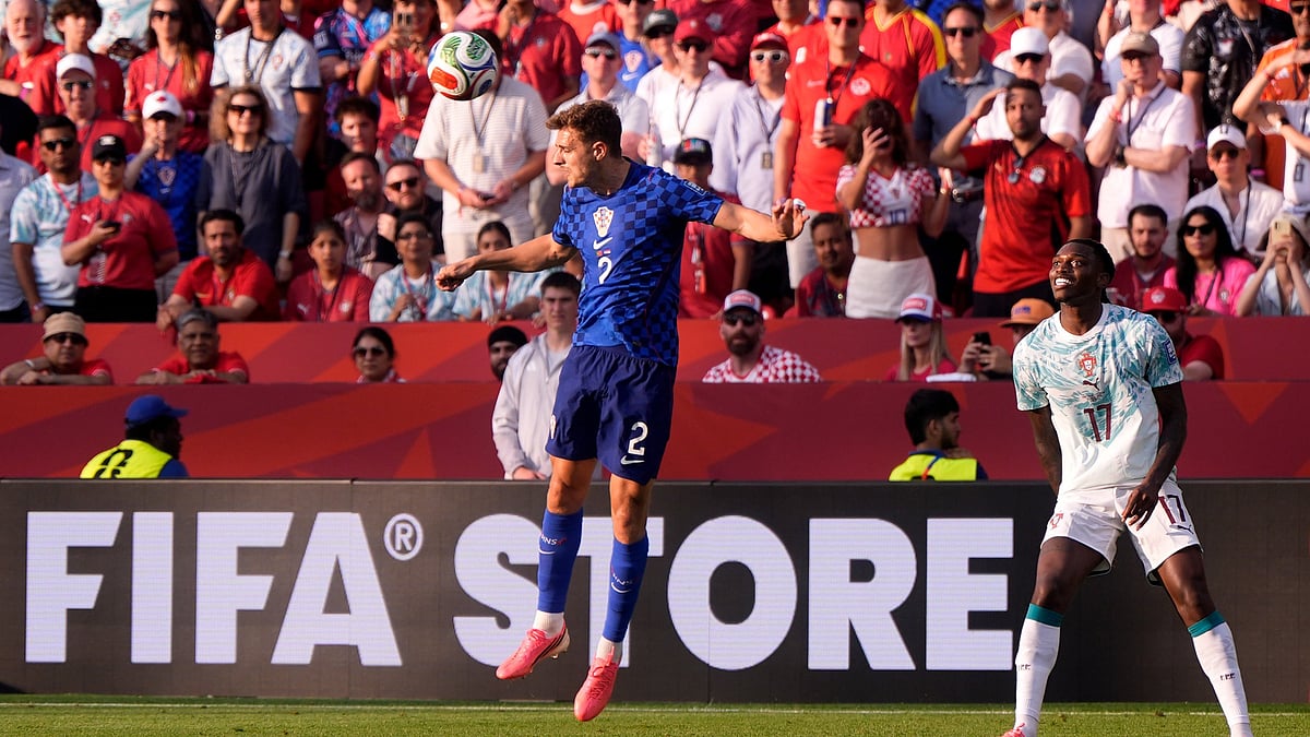 Croatia's Josip Stanisic (2) heads the ball as Portugal's Rafael Leao (17) looks on during the World Cup round of 32 soccer match between Portugal and Croatia in Toronto, Thursday, July 2, 2026. - (AP Photo/Mike Stewart)