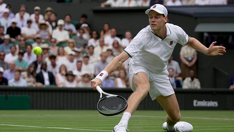 Jannik Sinner of Italy returns the ball to Nuno Borges of Portugal in their second round men's singles match at the Wimbledon Tennis Championships in London, Wednesday, July 1, 2026. - | Photo: AP/Brian Inganga