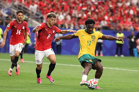 Australia's Nestory Irankunda (17) controls the ball ahead of Egypt's Emam Ashour (8) during the World Cup round of 32 soccer match between Australia and Egypt in Arlington