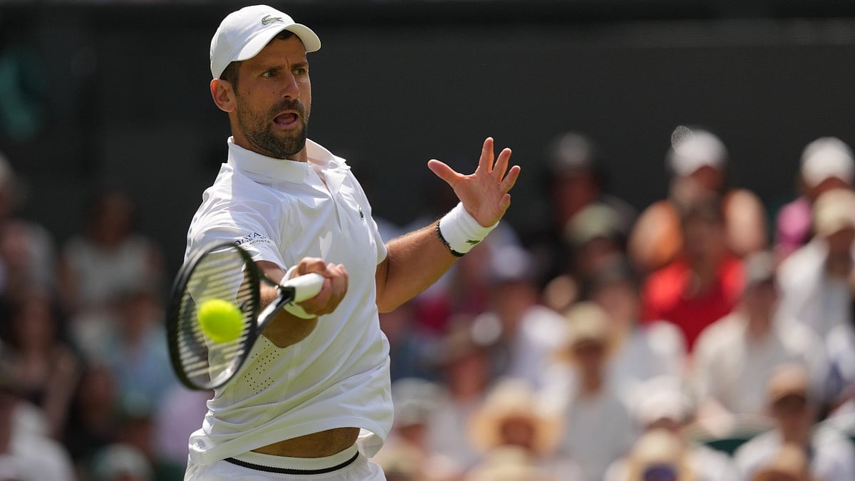 Novak Djokovic of Serbia returns the ball to Arthur Rinderknech of France in their third round men's singles match at the Wimbledon Tennis Championships in London, Friday, July 3, 2026.  - (AP Photo/Kin Cheung)