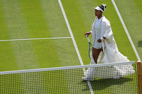 Naomi Osaka of Japan arrives on court to play against Daria Kasatkina of Australia in their third round women's singles match at the Wimbledon Tennis Championships in London, Friday, July 3, 2026.
