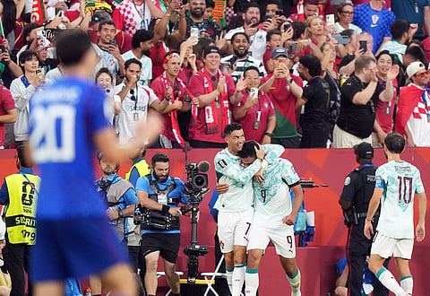 Portugal's Goncalo Ramos (9) is congratulated by Cristiano Ronaldo (7) after scoring a goal during the World Cup round of 32 soccer match between Portugal and Croatia in Toronto, Thursday, July 2, 2026.