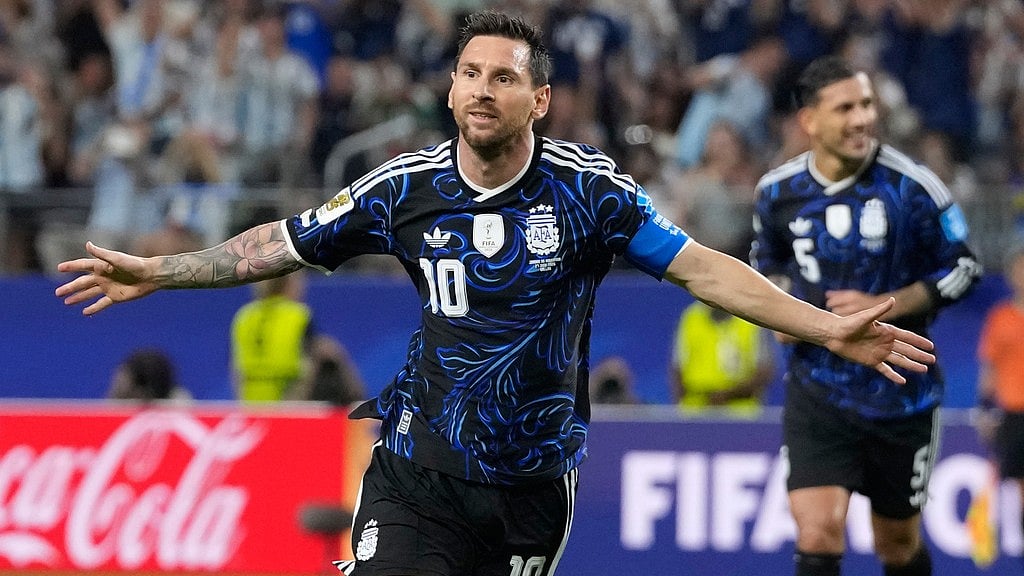 Argentina's Lionel Messi (10) celebrates scoring his side's 3rd goal during the World Cup Group J soccer match between Jordan and Argentina in Arlington - Tony Gutierrez/AP Photo