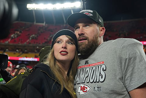 Kansas City Chiefs tight end Travis Kelce, right, is congratulated by Taylor Swift as they celebrate the Chiefs' victory over the Buffalo Bills in the AFC Championship NFL football game on Jan. 26, 2025. 